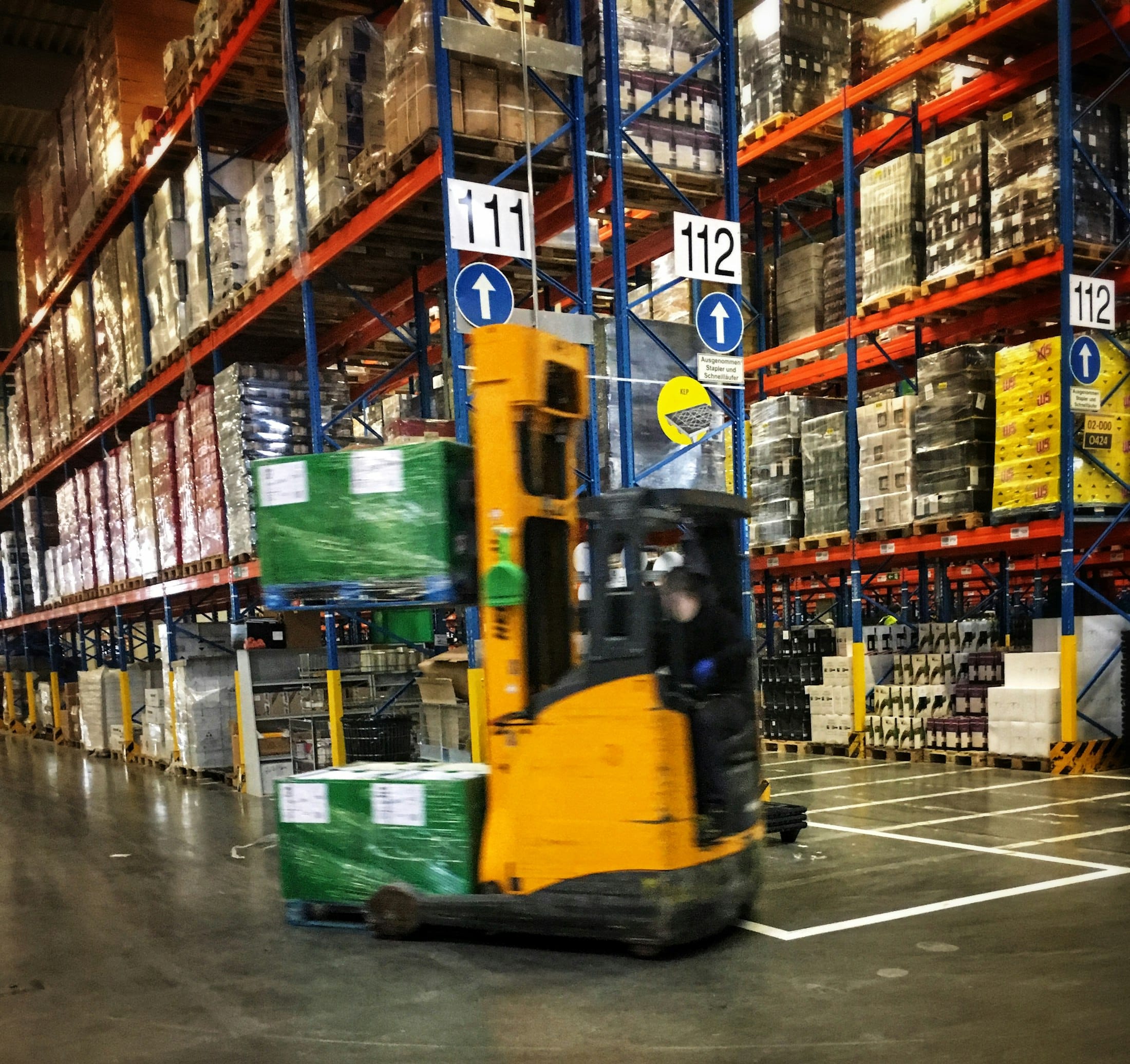 A forklift moving palletised goods